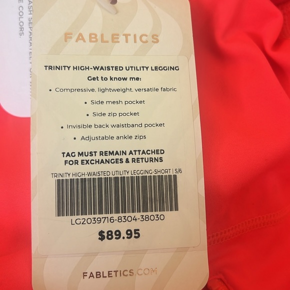 Fabletics bright orange leggings with zipper at the ankle and side pockets. - Picture 4 of 4